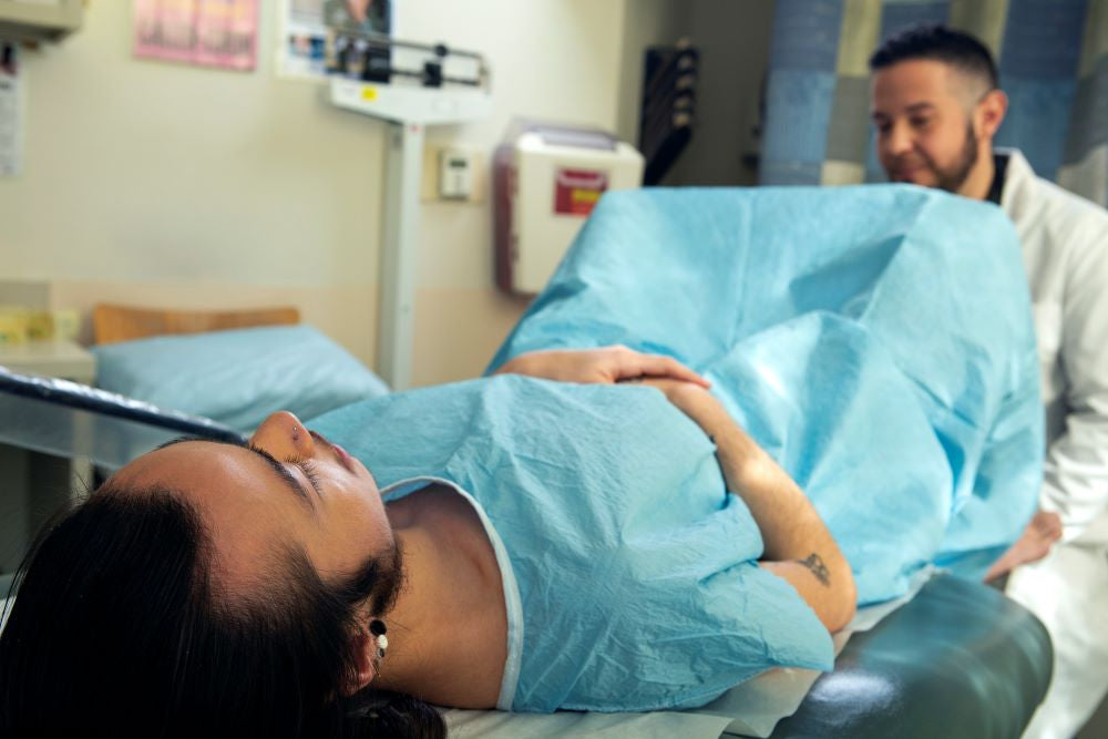 genderqueer person receives a pelvic exam