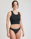 Front view of a person wearing black thong period underwear | Black