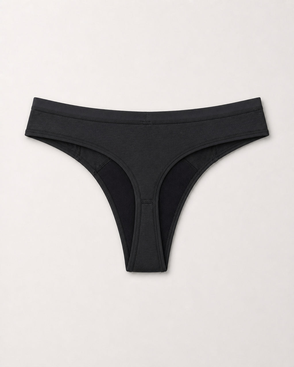 Black thong on a light gray background | Black