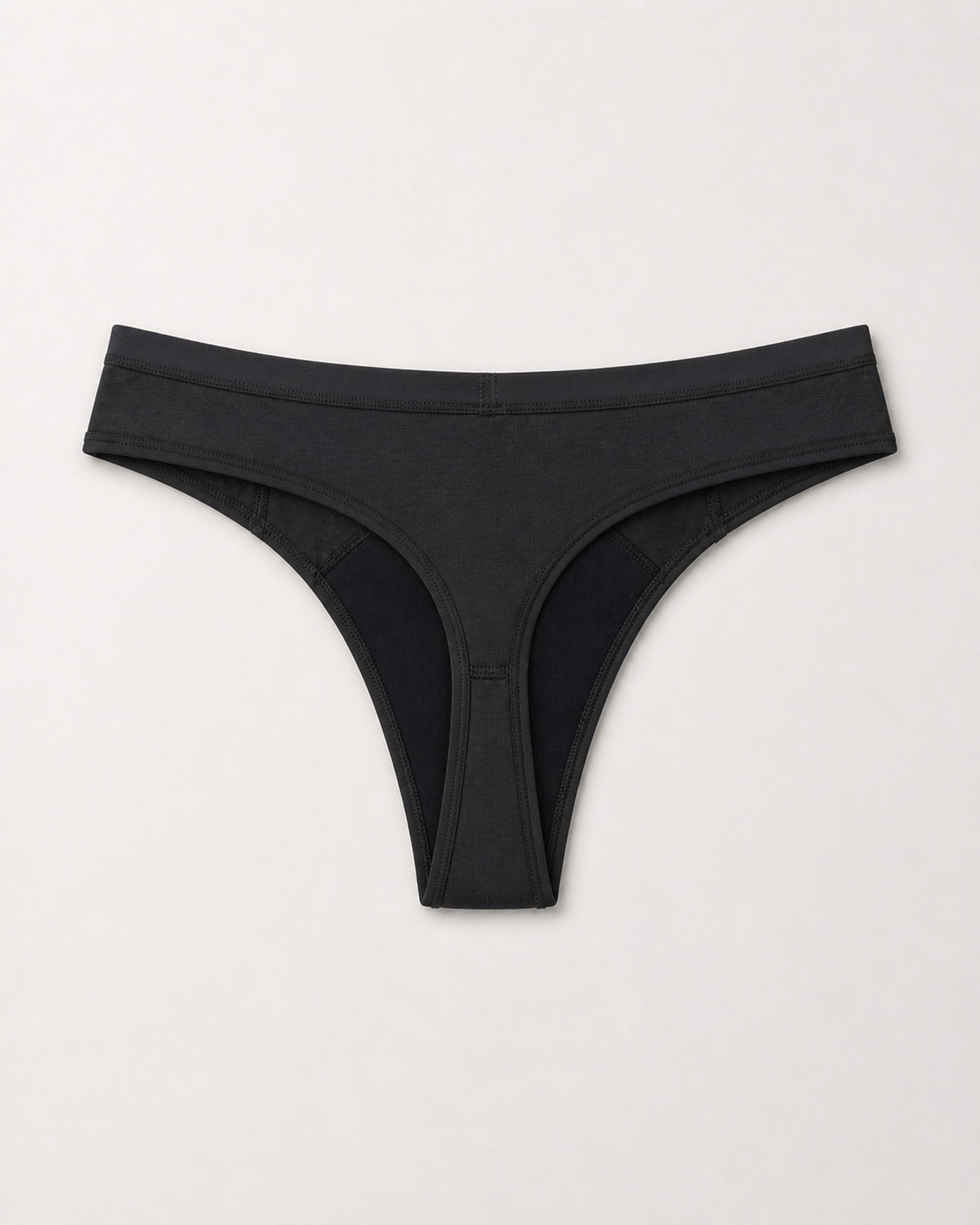 Black thong on a light gray background | Black