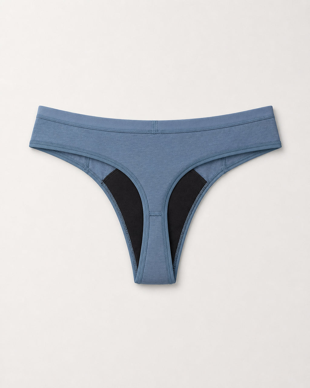 Blue thong with black accents on a light gray background | Denim