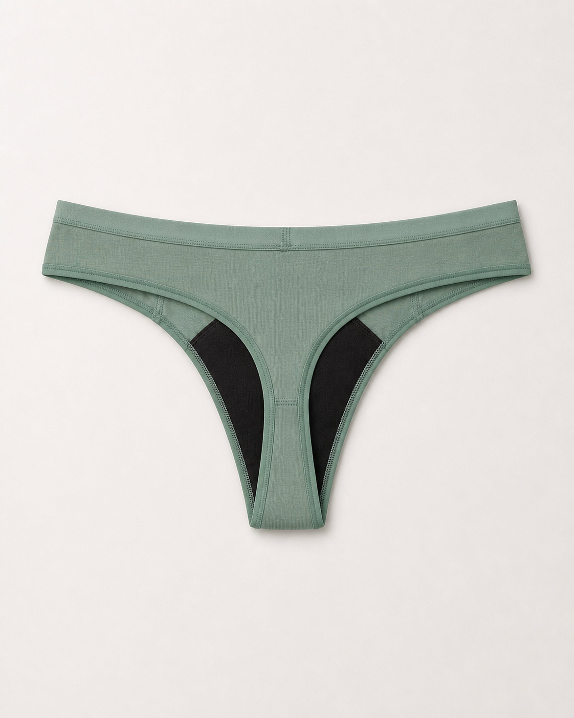 Green thong with black accents on a light gray background | Eucalyptus