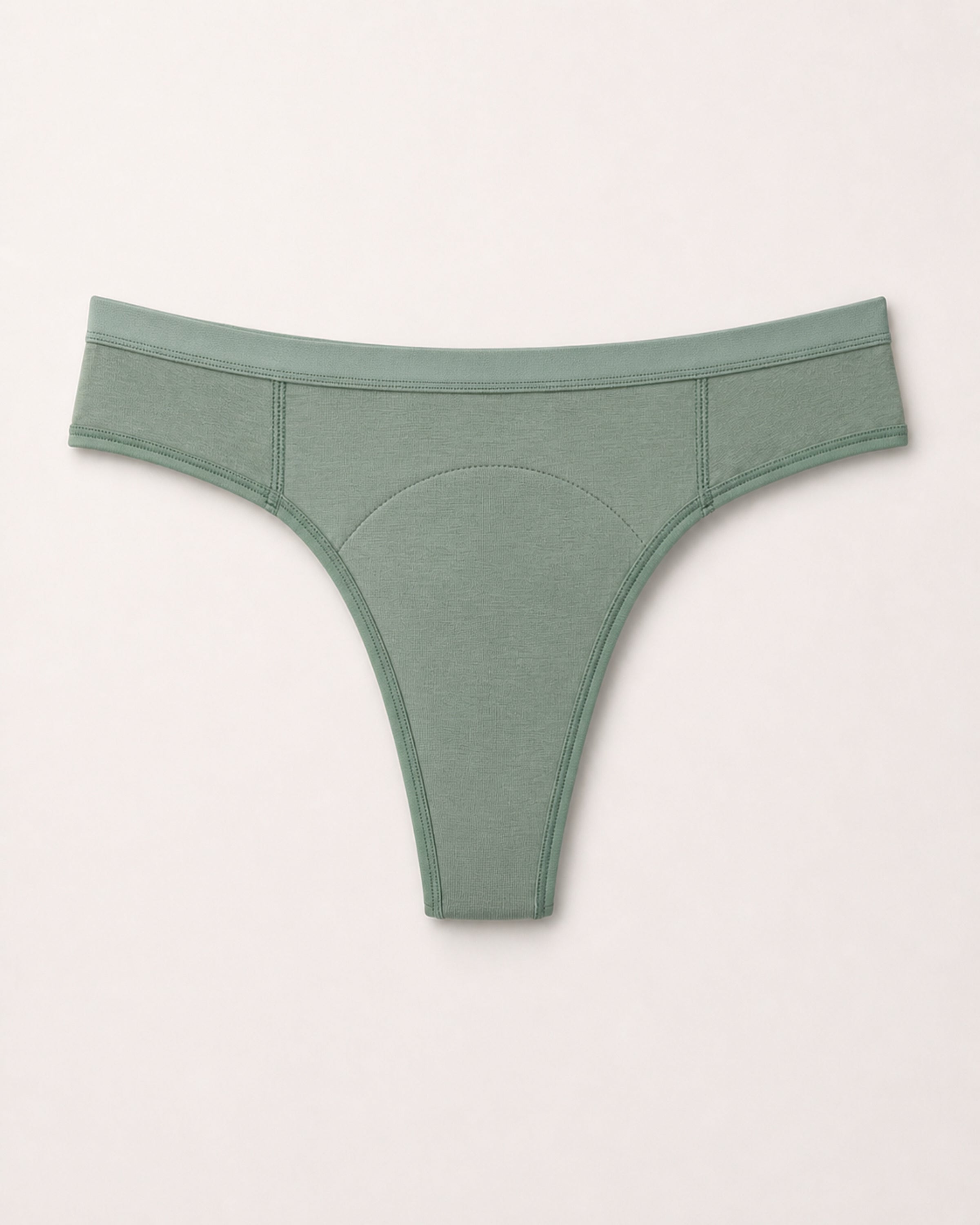 Green thong with black accents on a light gray background | Eucalyptus