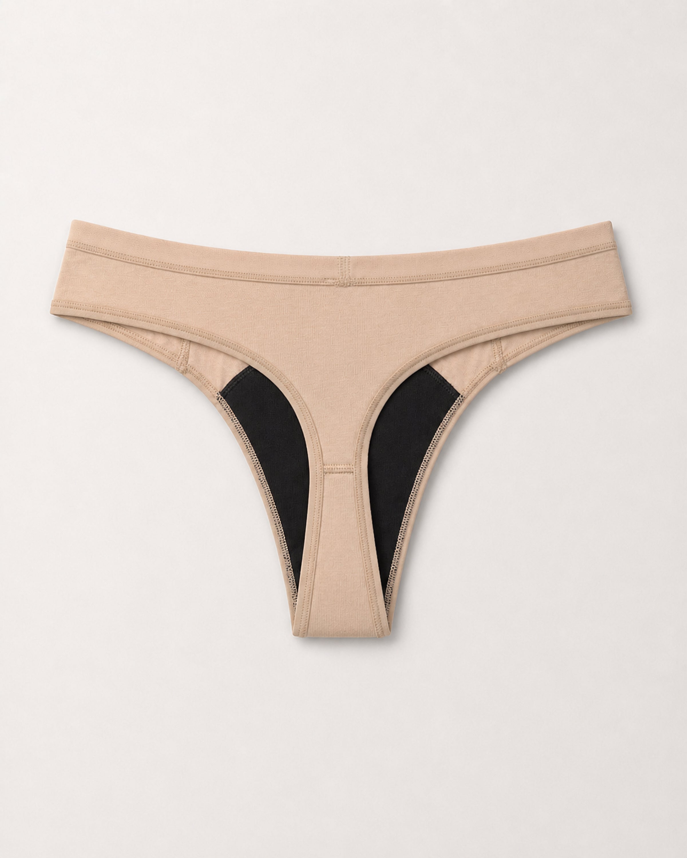 Beige thong on a light grey background | Fawn