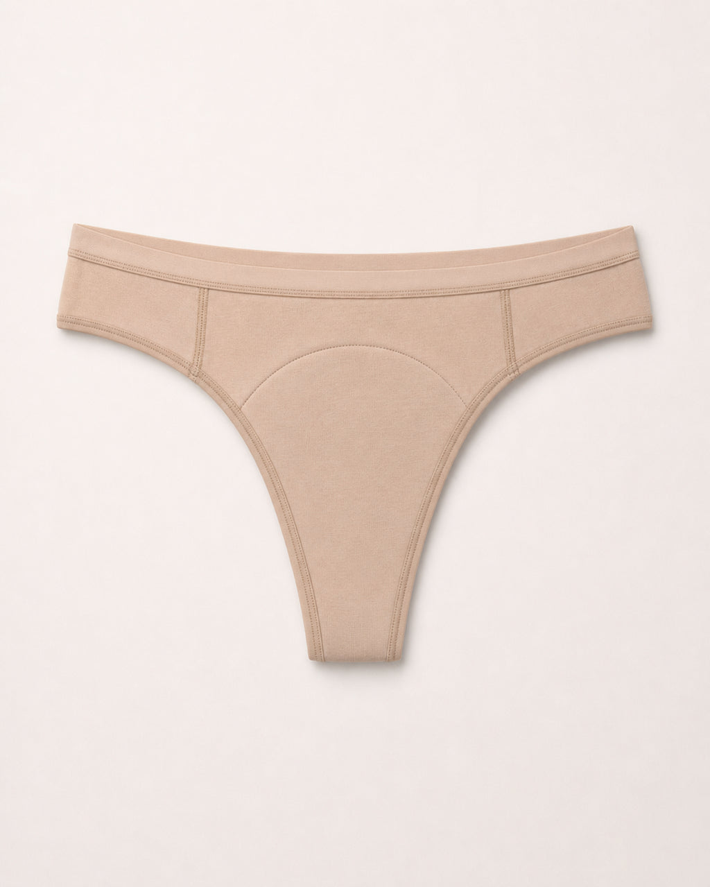 Beige thong on a light grey background | Fawn
