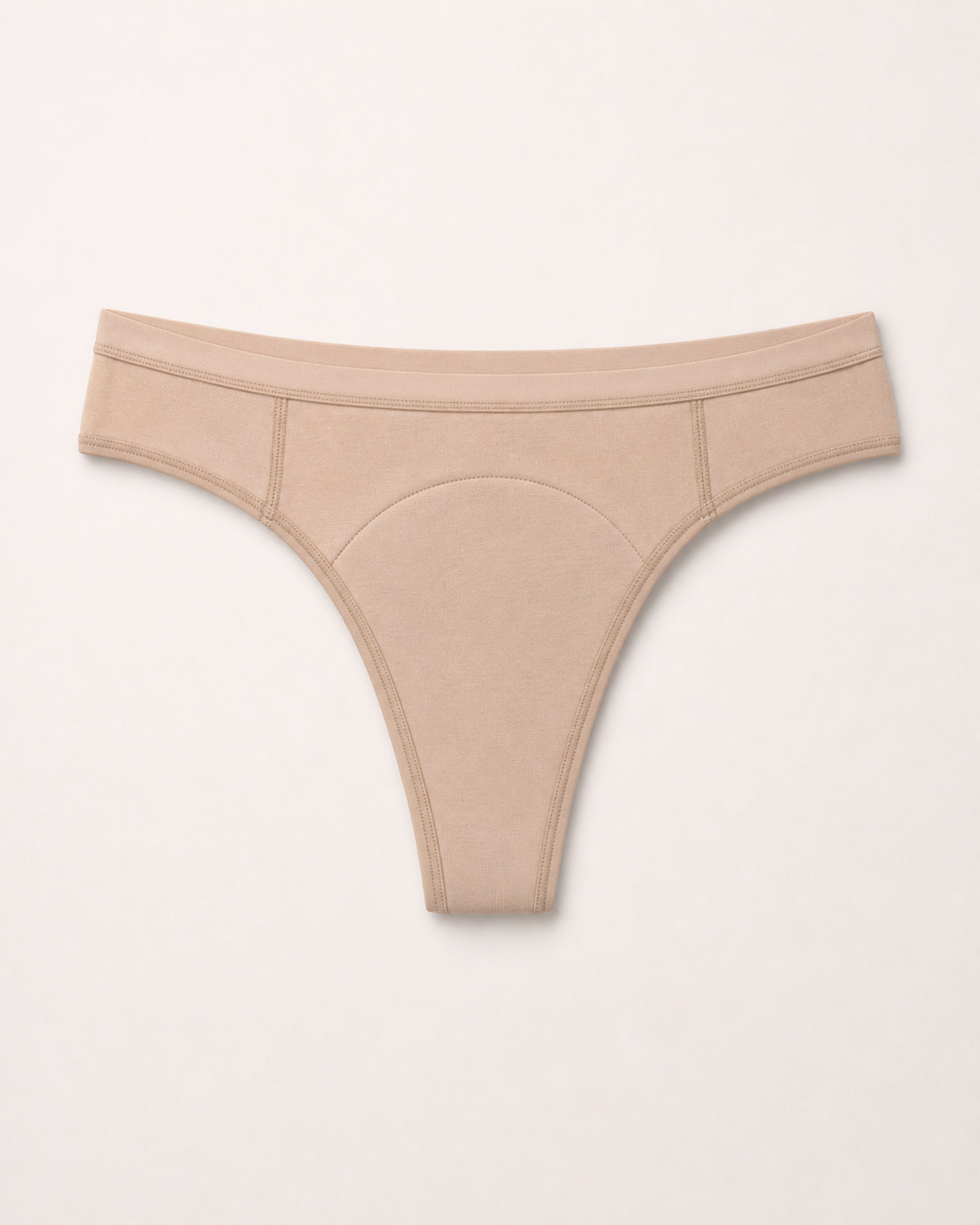 Beige thong on a light grey background | Fawn